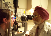 photo pf Dr. Hayreh with patient